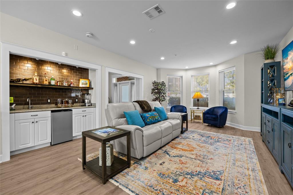 127 Northeast 3rd Street Gainesville, FL 32601 - Photo 5 of 30 a living room with furniture and a flat screen tv
