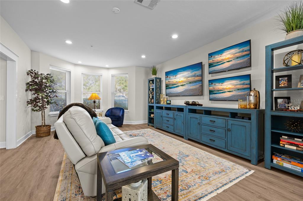 127 Northeast 3rd Street Gainesville, FL 32601 - Photo 6 of 30 a living room with furniture and a flat screen tv