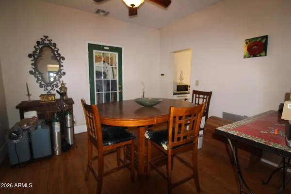 a view of a dining room with furniture and wooden floor