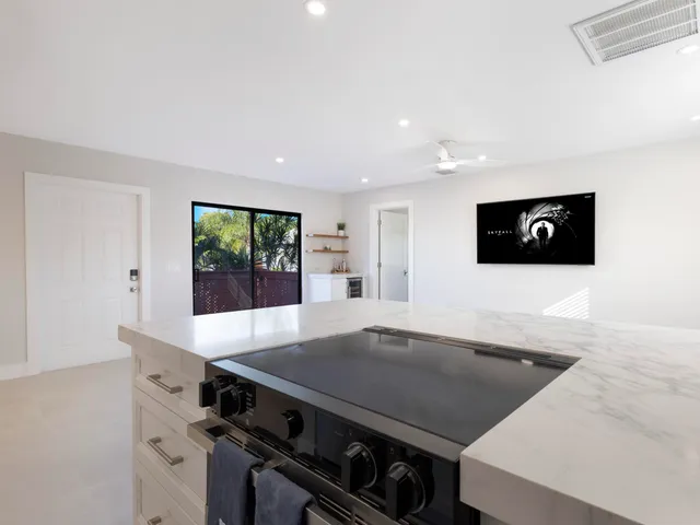 an empty room with a empty space and windows