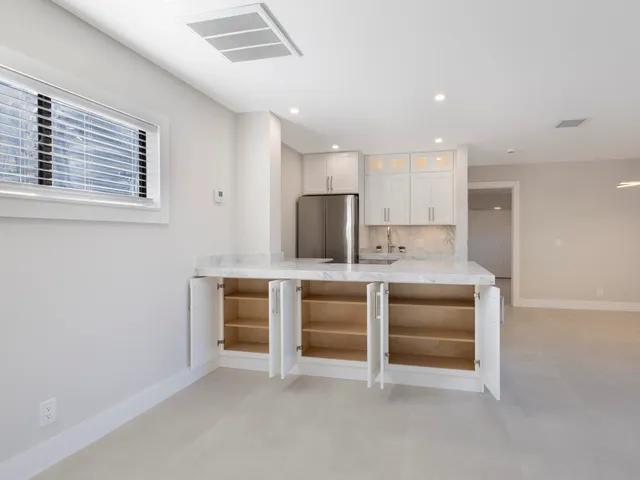 a bedroom with a bed and couch