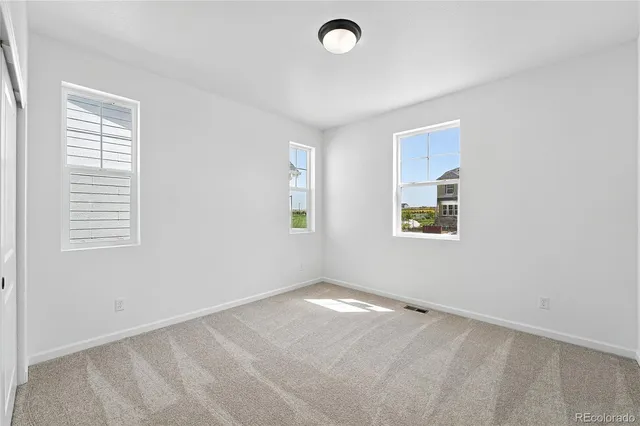 an empty room with windows