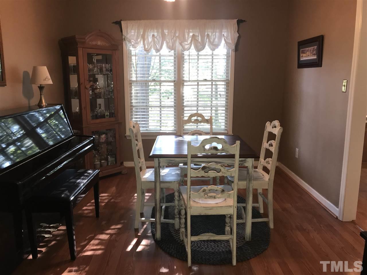 4740 Worcester Place Raleigh, NC 27604 - Photo 5 of 25 a dining room with furniture and wooden floor