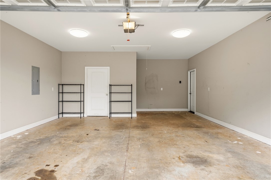 1411 Dunn Road Anderson, SC 29625 - Photo 25 of 30 This spacious garage offers practical storage solutions with an overhead door.