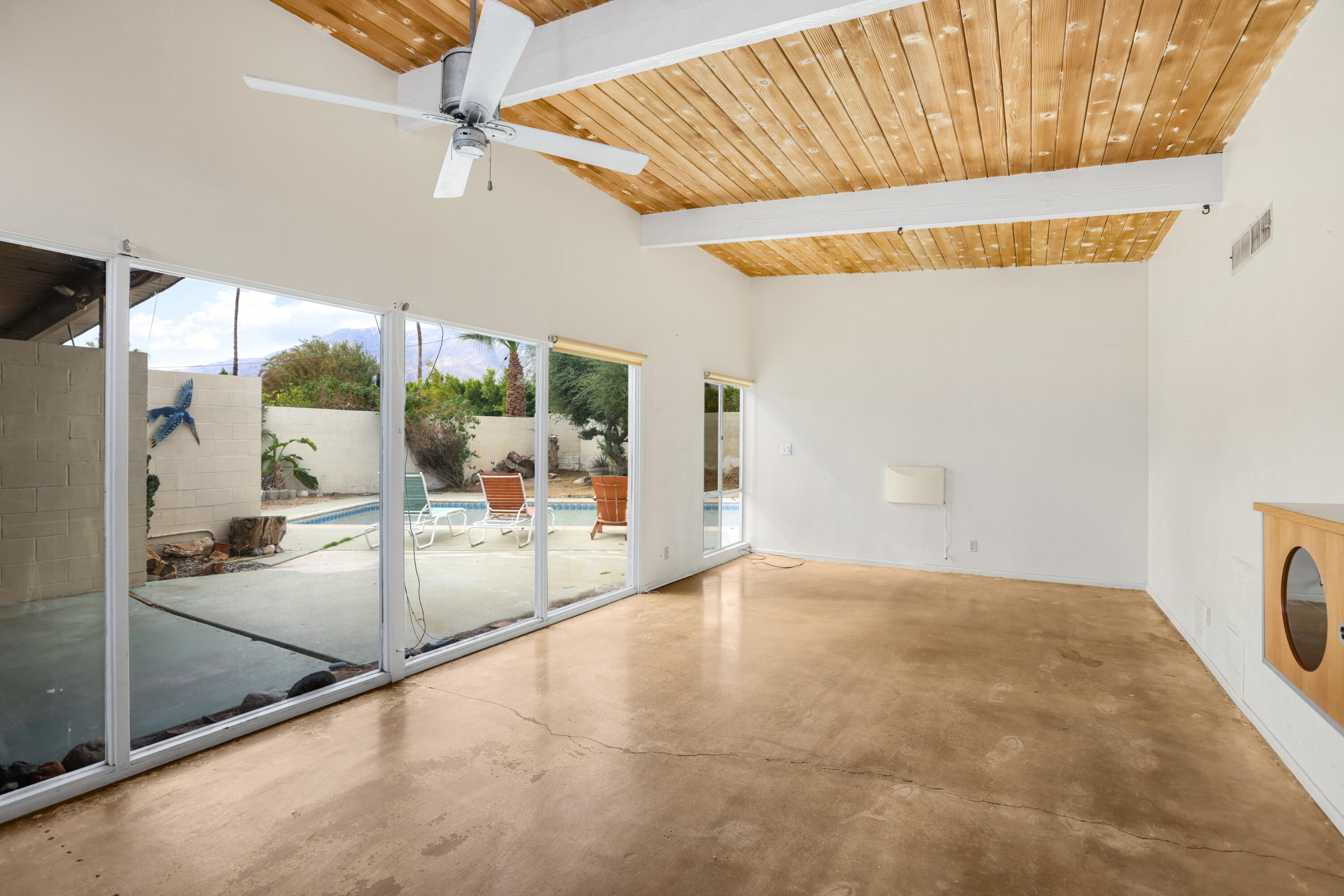 2839 North Davis Way Palm Springs, CA 92262 - Photo 2 of 29 a view of a livingroom with furniture and floor to ceiling window