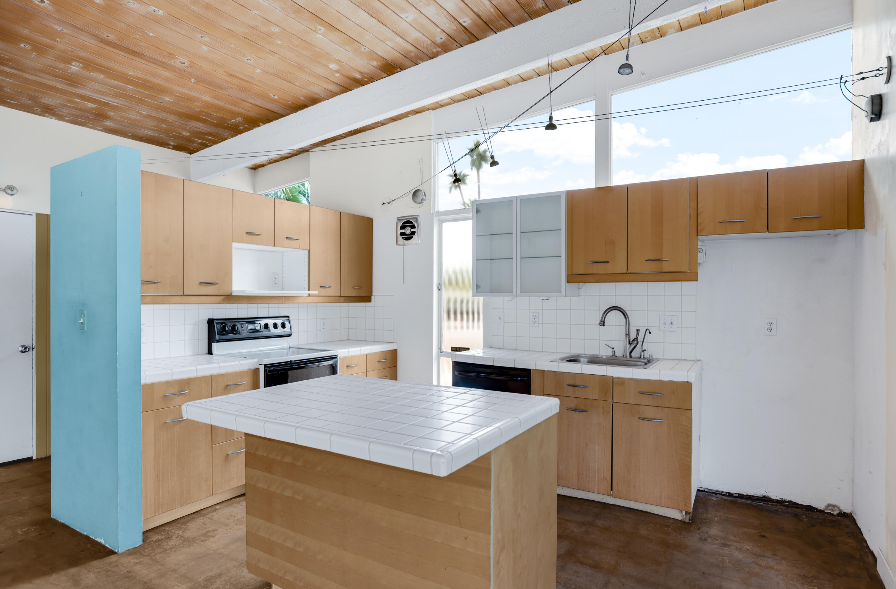 2839 North Davis Way Palm Springs, CA 92262 - Photo 3 of 29 a kitchen with a sink stove and cabinets