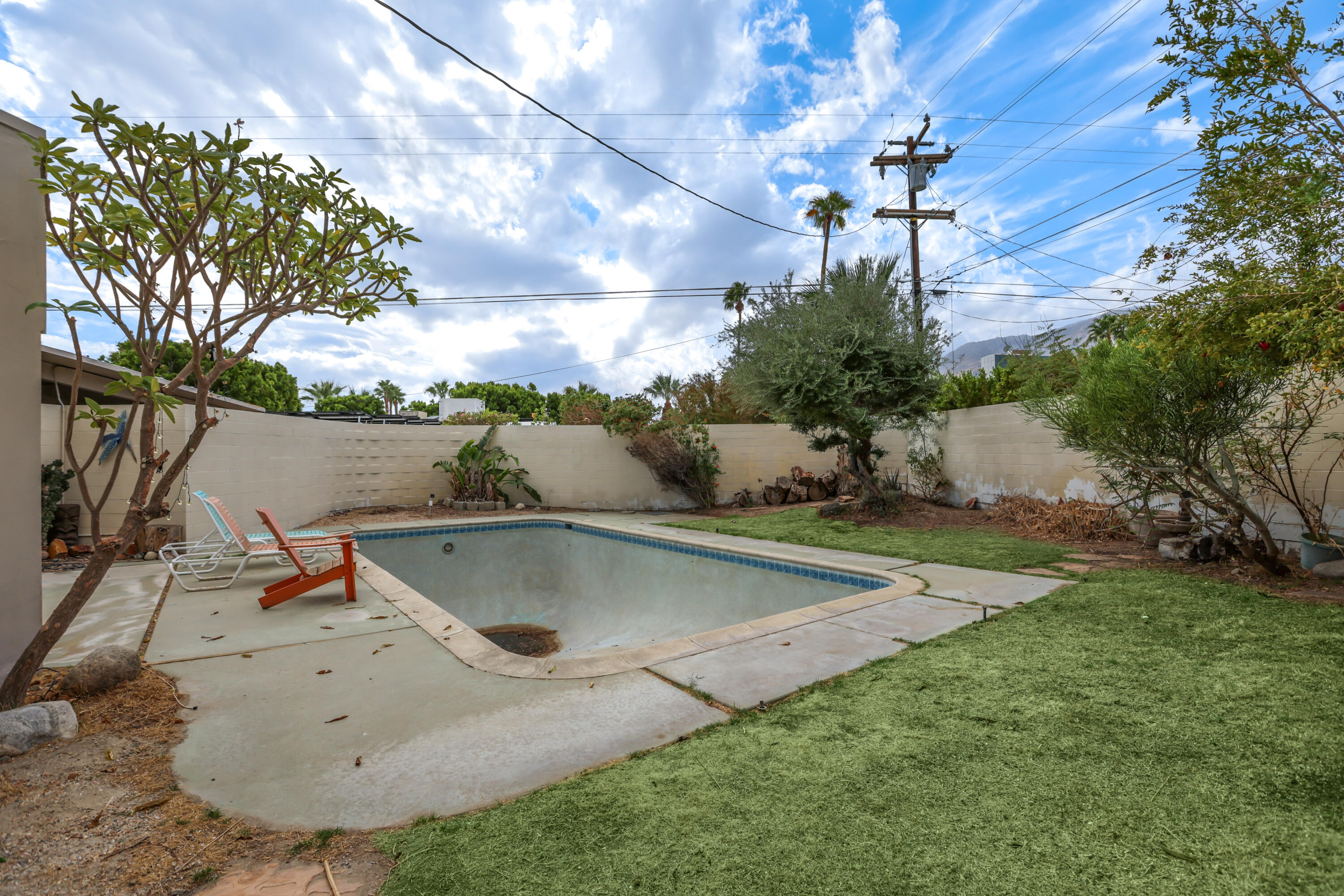2839 North Davis Way Palm Springs, CA 92262 - Photo 5 of 29 a view of a swimming pool with an outdoor space and seating area