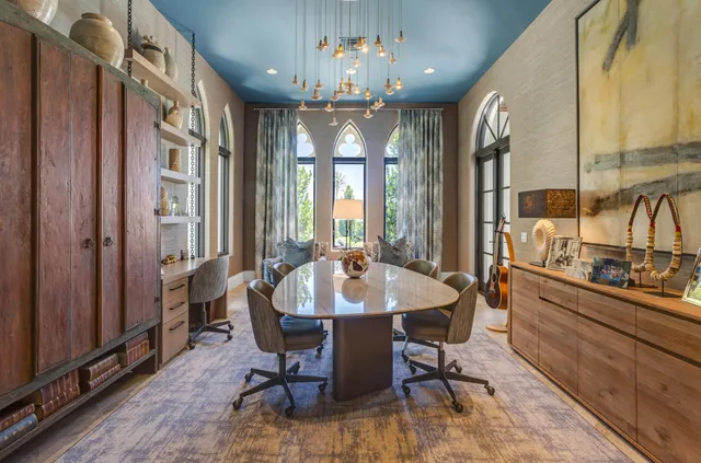 a bathroom with a sink a toilet a mirror and a shower