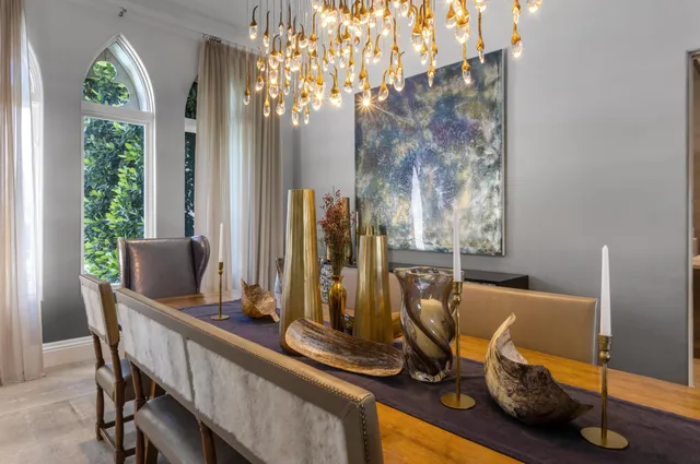a view of a terrace with chairs and potted plants