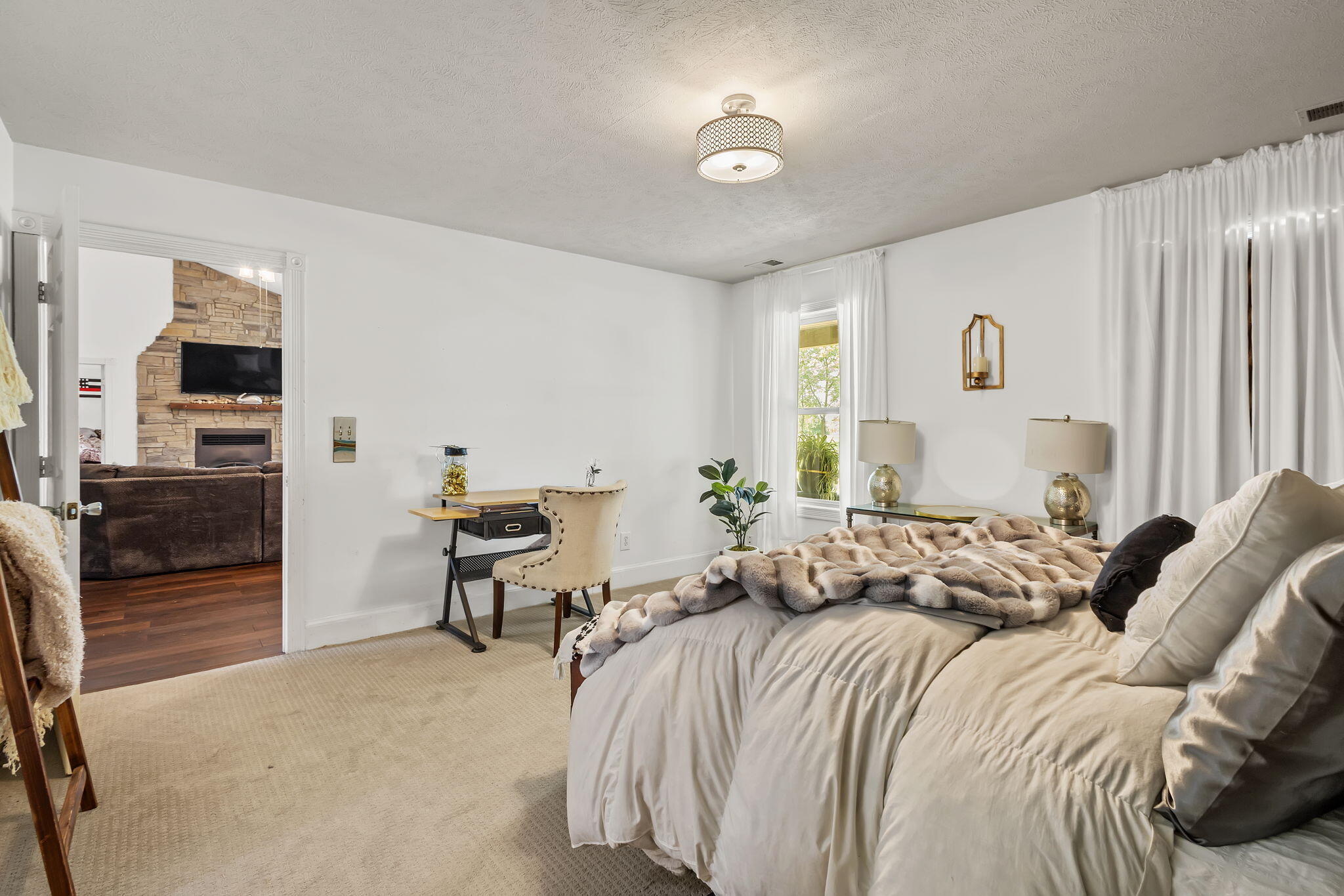 4381 Highway 231 Rensselaer, IN 47978 - Photo 14 of 30 a bedroom with a bed and wooden floor