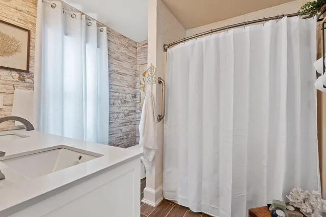 a bathroom with a sink and a large mirror