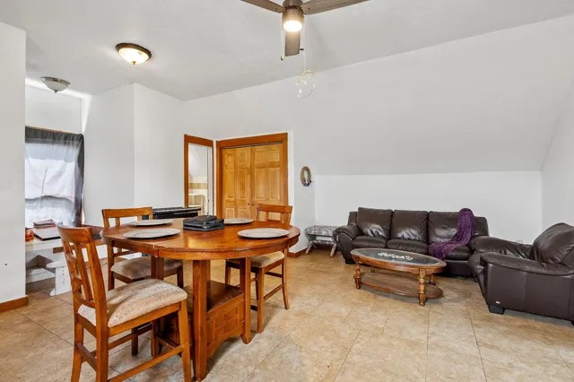 a view of a livingroom with furniture and window