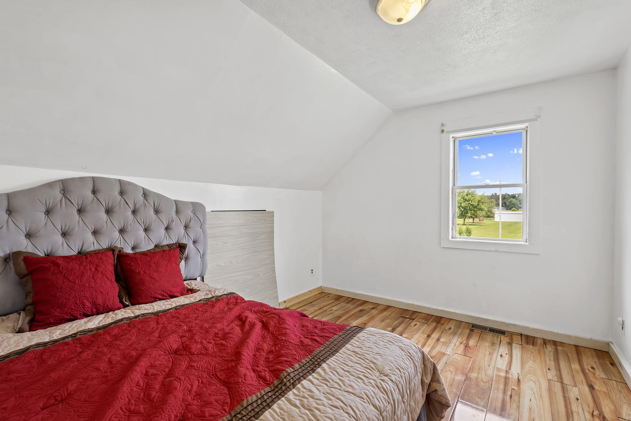 4381 Highway 231 Rensselaer, IN 47978 - Photo 24 of 30 a bedroom with a bed and a window