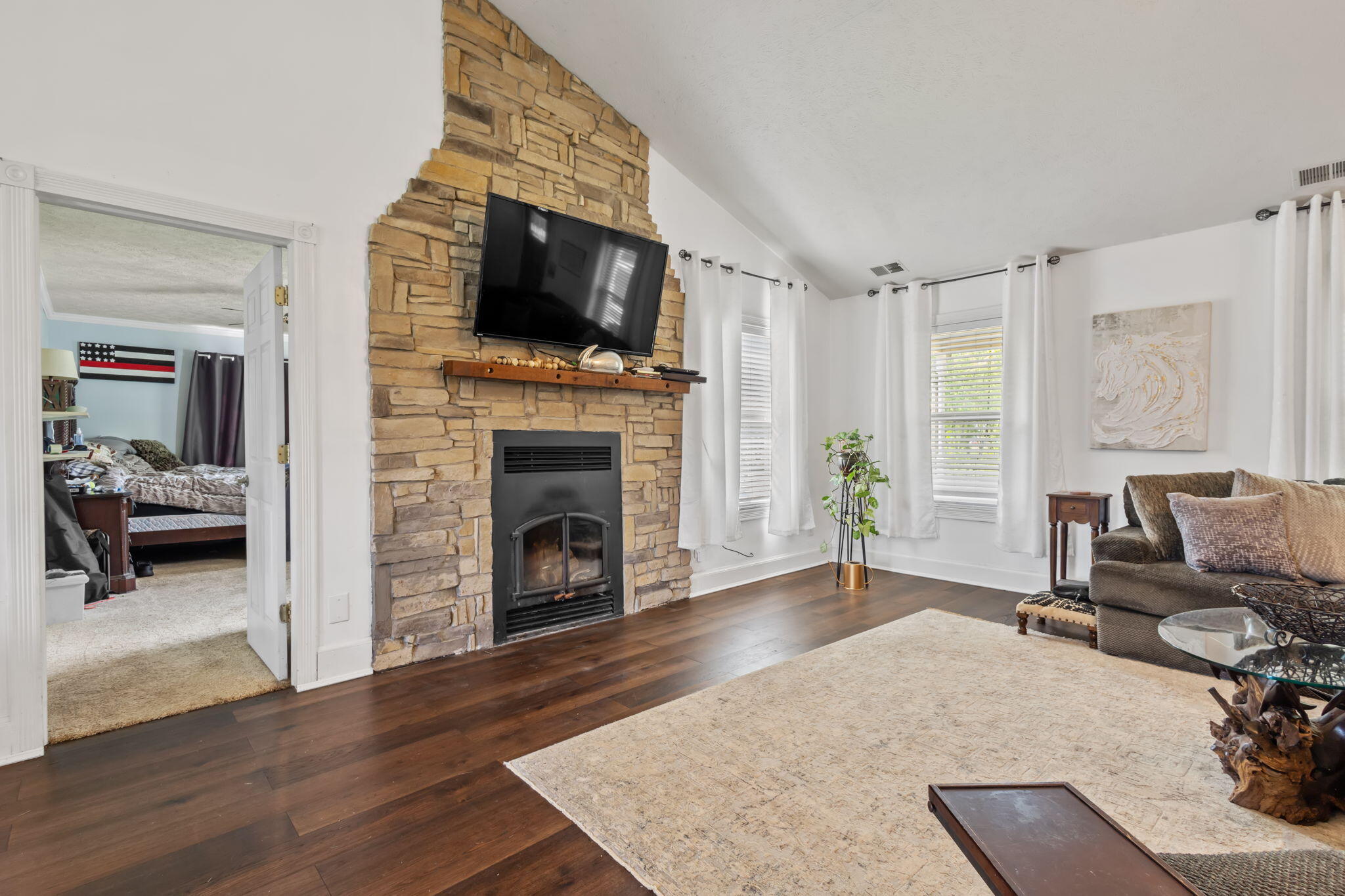4381 Highway 231 Rensselaer, IN 47978 - Photo 6 of 30 a living room with furniture a flat screen tv and a fireplace