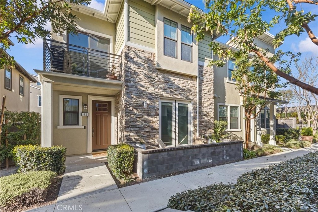 a view of a brick building with large windows
