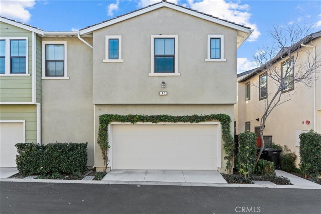 42 Concepcion Street Rancho Mission Viejo, CA 92694 - Photo 25 of 36 a front view of a house with a yard and garage