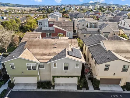 an aerial view of a house with a yard