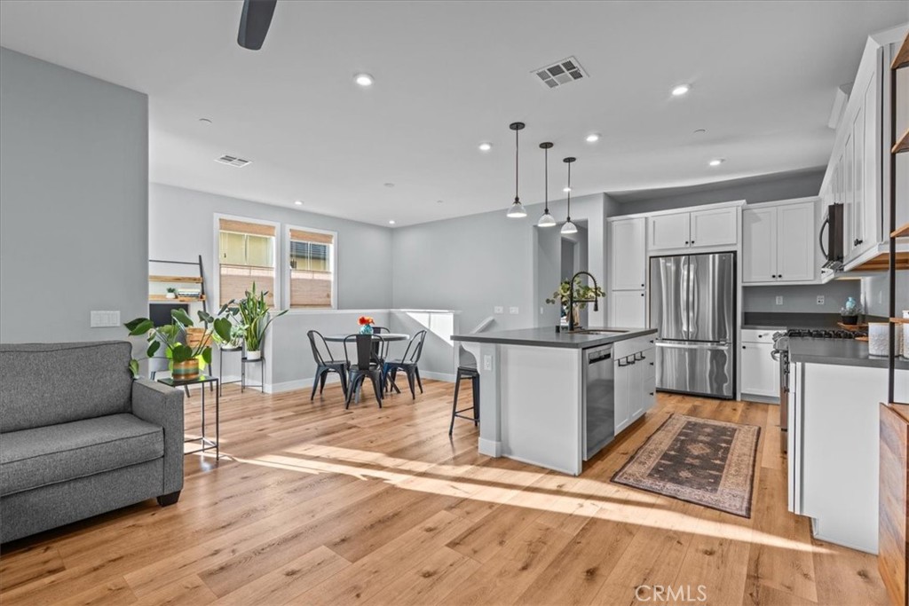 42 Concepcion Street Rancho Mission Viejo, CA 92694 - Photo 8 of 36 a living room with stainless steel appliances kitchen island granite countertop furniture and a kitchen view