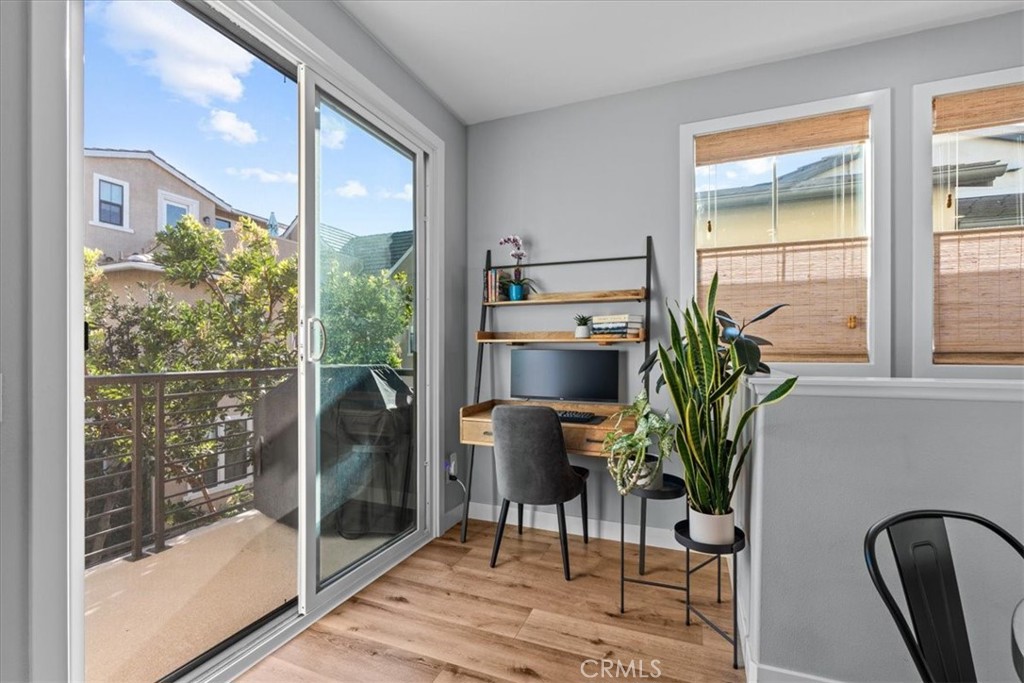 42 Concepcion Street Rancho Mission Viejo, CA 92694 - Photo 10 of 36 a room with a chair and a potted plant