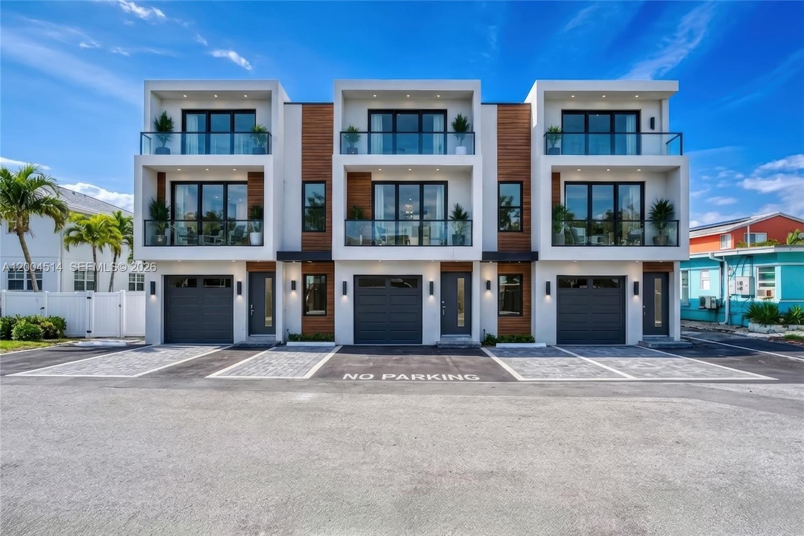 318 Walnut Street Hollywood, FL 33019 - Photo 15 of 15 a front view of building with a garden
