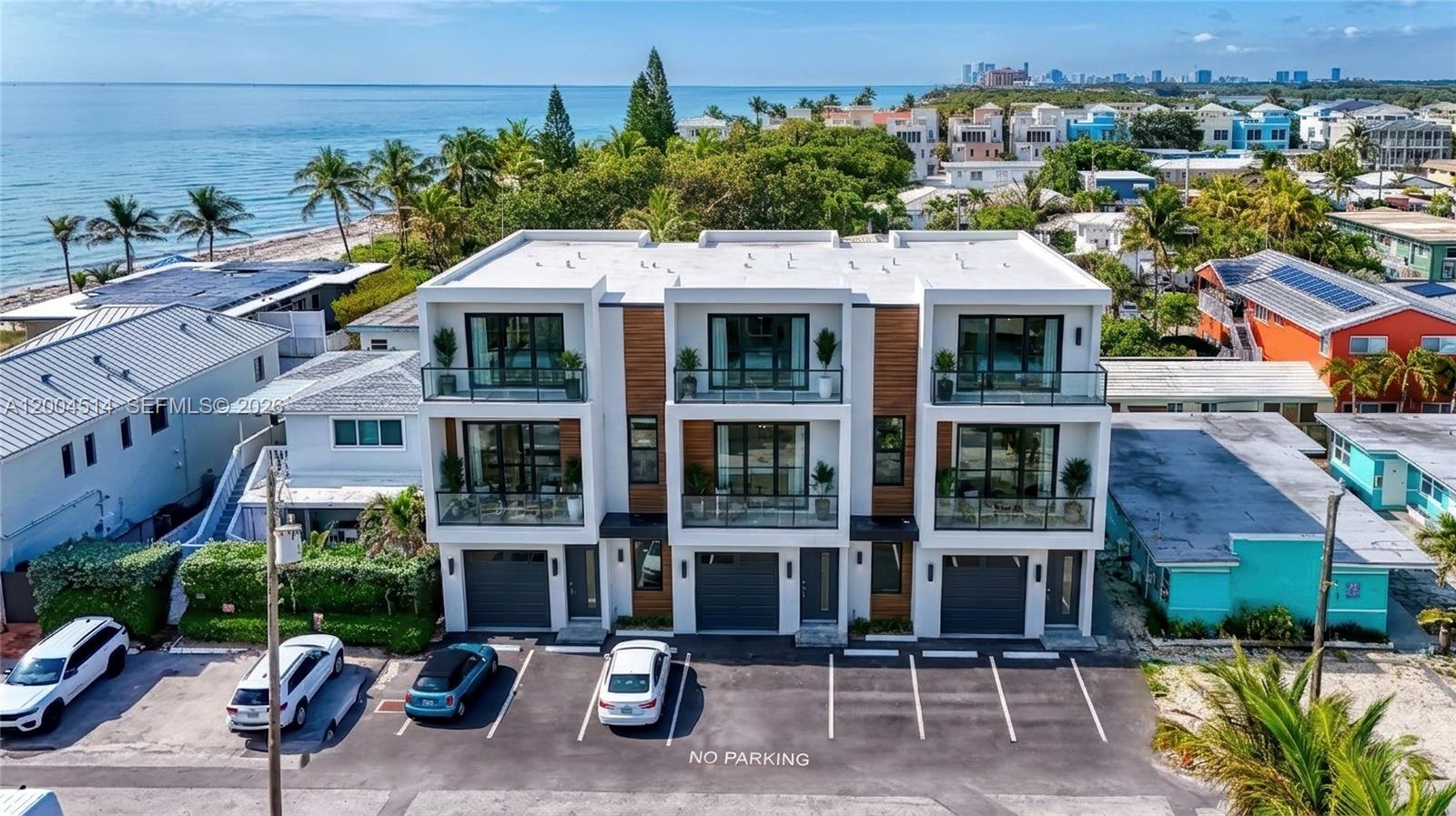 318 Walnut Street Hollywood, FL 33019 - Photo 3 of 15 a aerial view of a house with a porch and a table under an umbrella