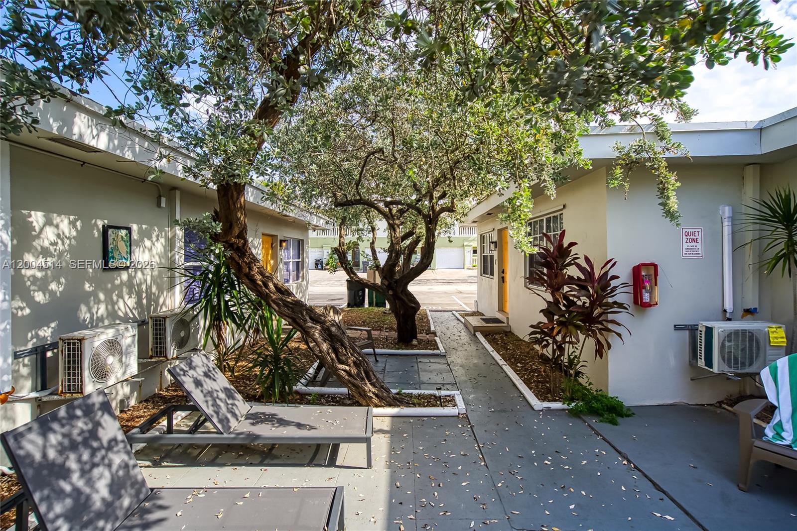 318 Walnut Street Hollywood, FL 33019 - Photo 8 of 15 a view of a house with a tree