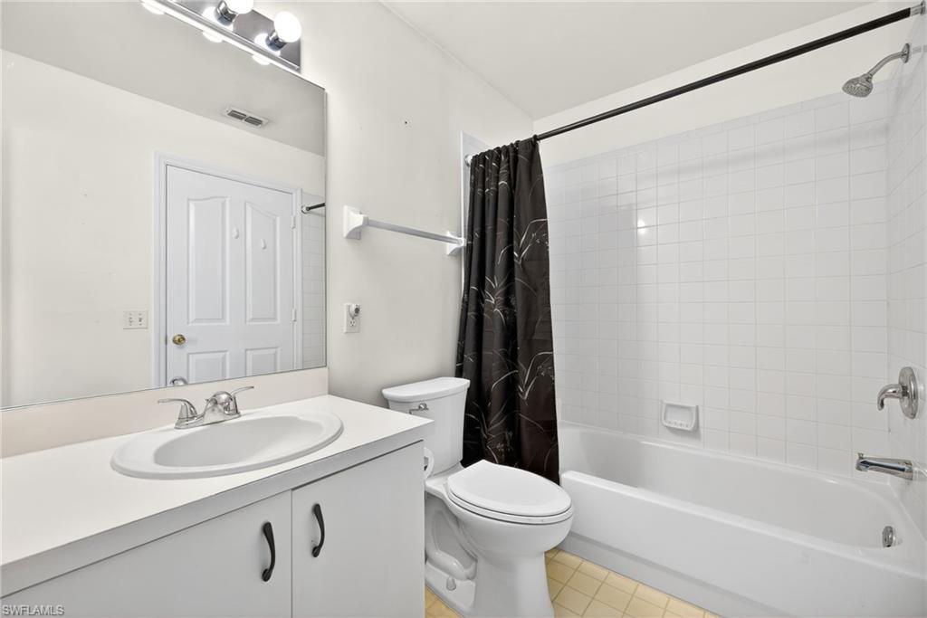 6316 Shadowood Circle Naples, FL 34112 - Photo 15 of 26 a bathroom with a sink toilet and shower