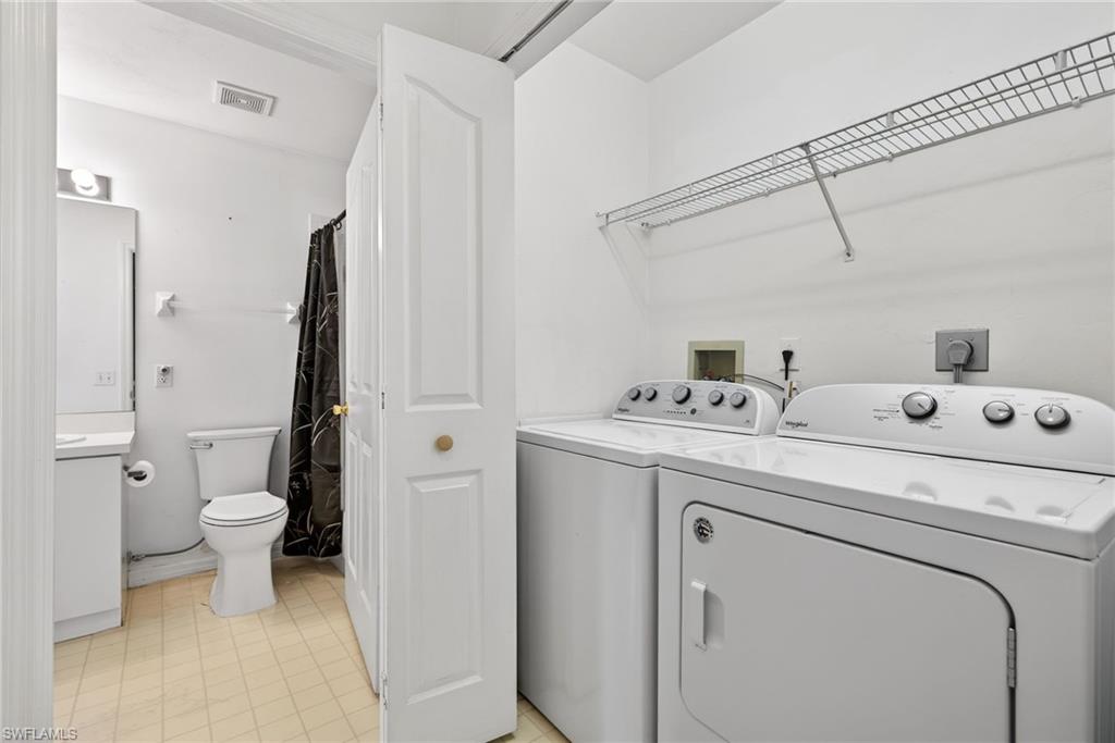 6316 Shadowood Circle Naples, FL 34112 - Photo 18 of 26 a utility room with dryer and washer