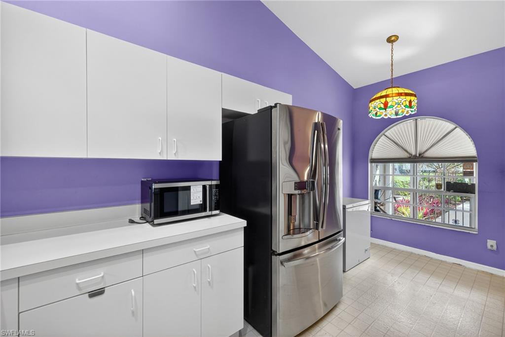 6316 Shadowood Circle Naples, FL 34112 - Photo 4 of 26 a kitchen with stainless steel appliances granite countertop a refrigerator and a stove