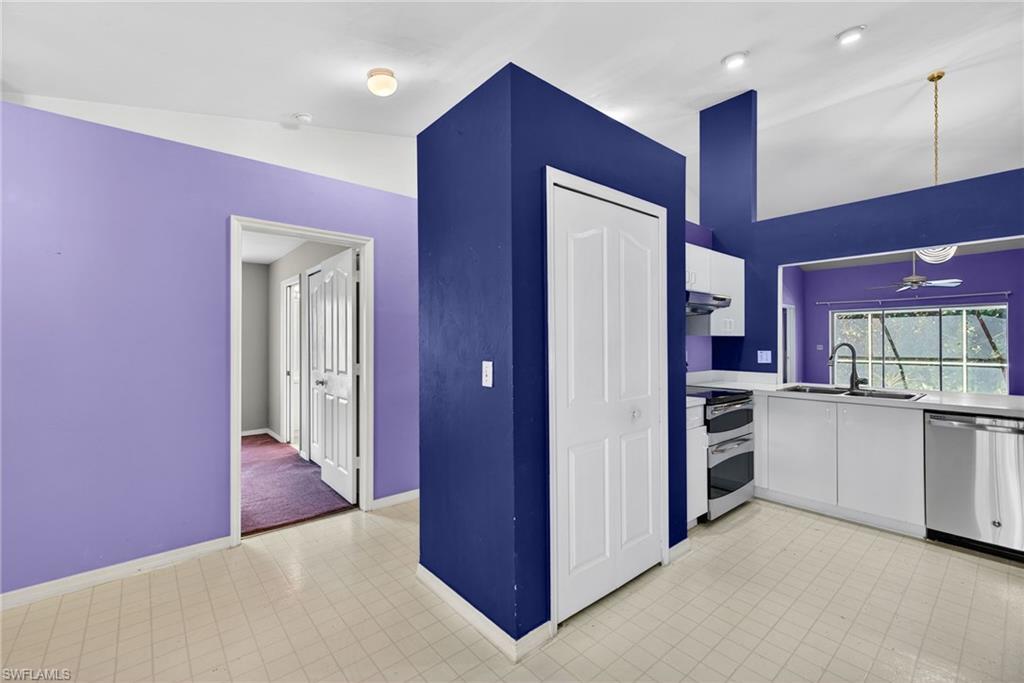 6316 Shadowood Circle Naples, FL 34112 - Photo 5 of 26 a view of a kitchen with a refrigerator and cabinets