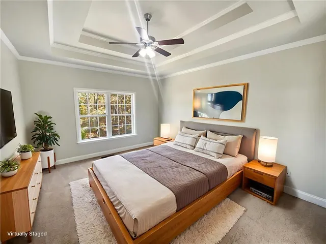 a bedroom with bed and a window