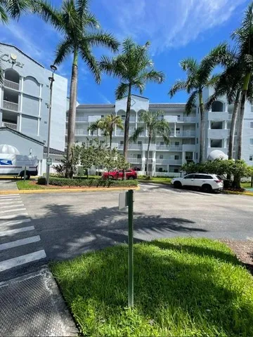 a sign board with yard in front of it