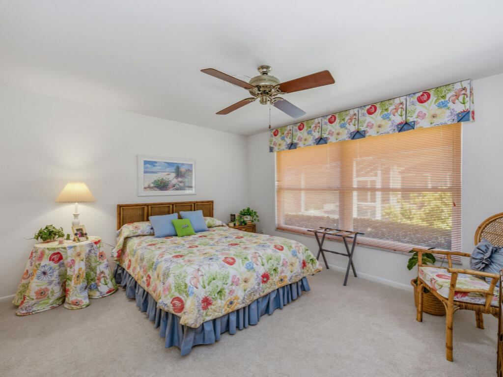 314 Torrey Pines Point Naples, FL 34113 - Photo 10 of 21 a bedroom with a bed and a large window