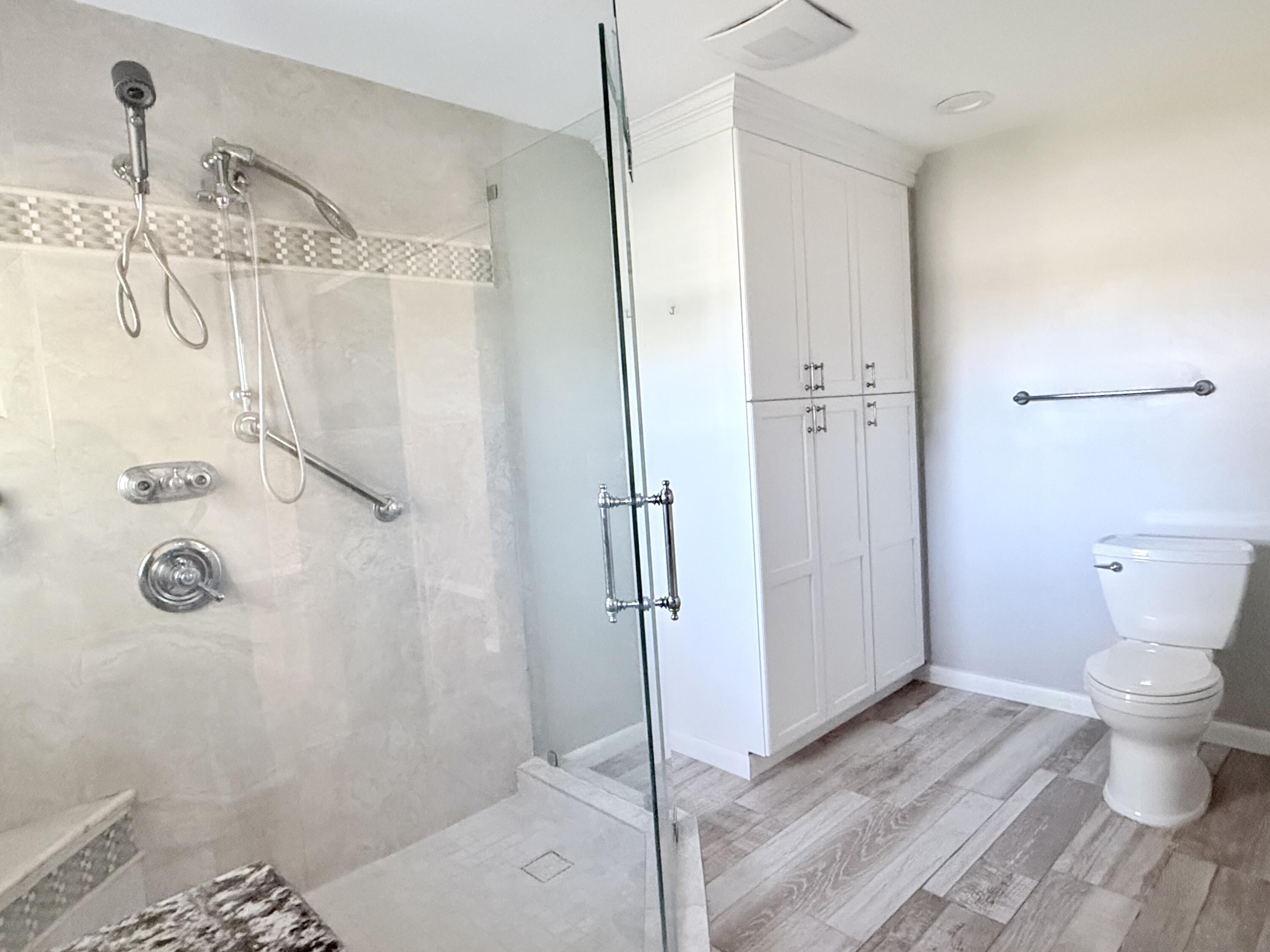 82 Sandpiper Way Boynton Beach, FL 33436 - Photo 15 of 24 a bathroom with a shower toilet and sink