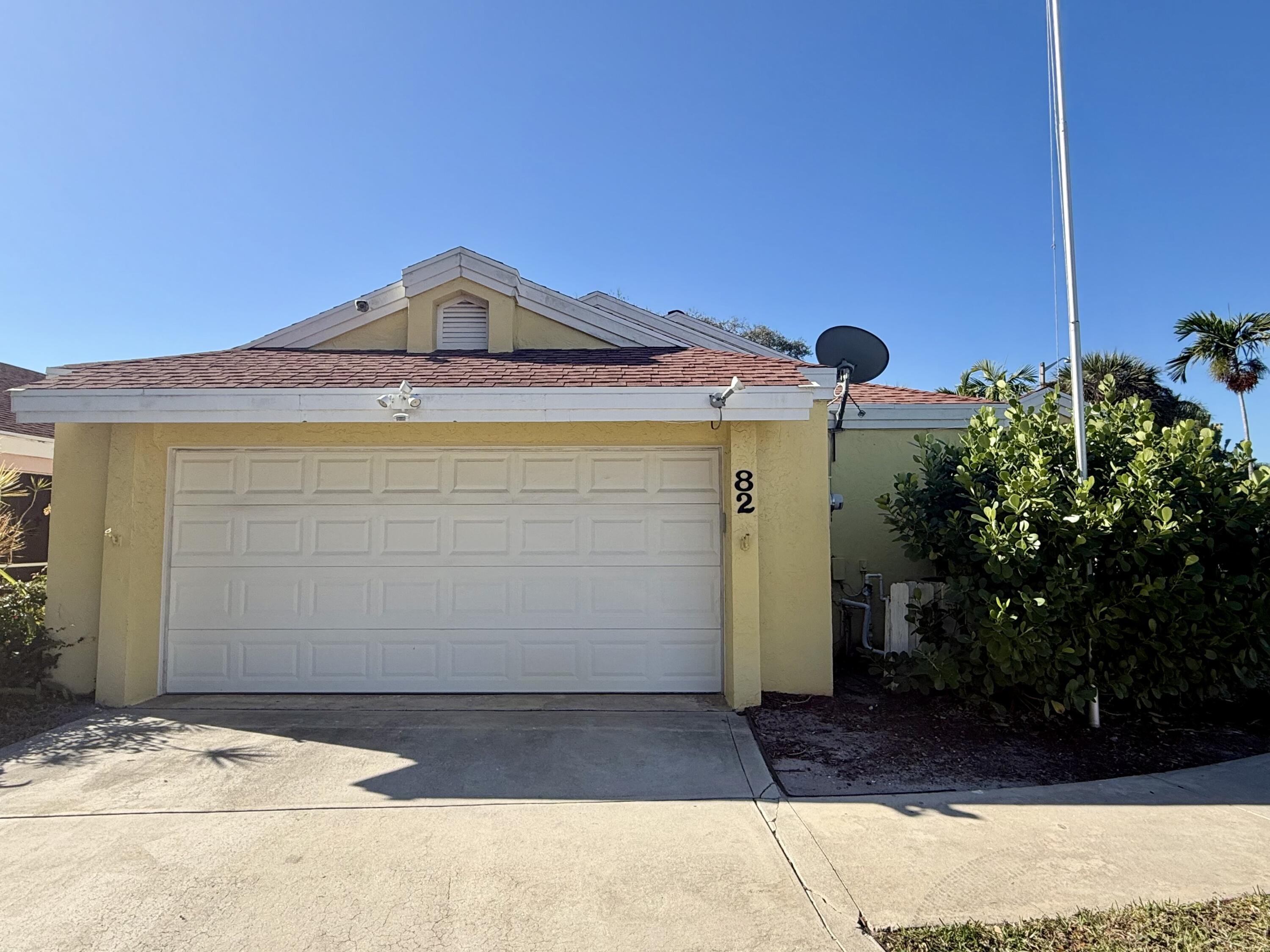82 Sandpiper Way Boynton Beach, FL 33436 - Photo 23 of 24 a view of a house with a yard