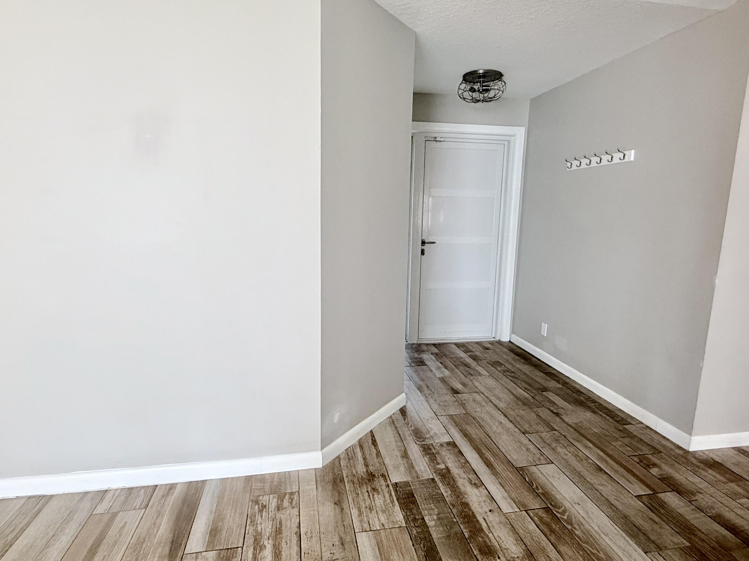 82 Sandpiper Way Boynton Beach, FL 33436 - Photo 3 of 24 a view of a bedroom with wooden floor