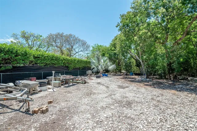 a view of outdoor space with deck and trees