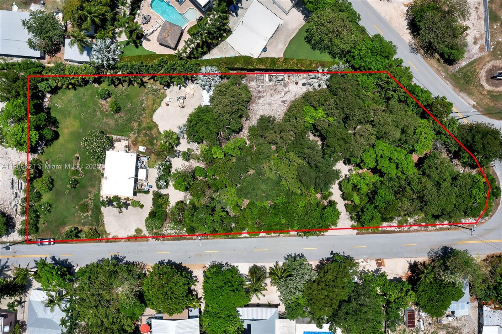 306 Lime Street Key Largo, FL 33037 - Photo 9 of 37 an aerial view of a house with a yard and garden