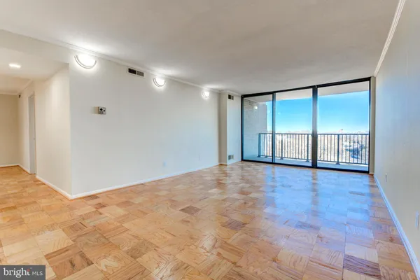 a view of an empty room with a window