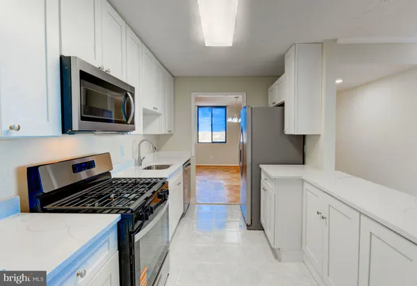 a kitchen with a stove and a microwave