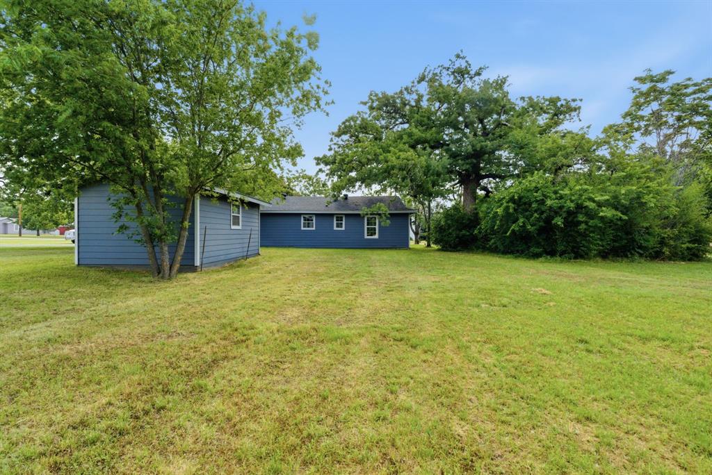 203 North Kickapoo Street Lipan, TX 76462 - Photo 24 of 28 a view of a house with a yard