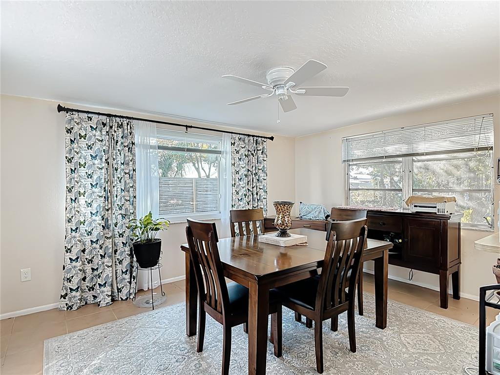 9420 Cochise Lane Port Richey, FL 34668 - Photo 20 of 47 a view of a dining room with furniture and window