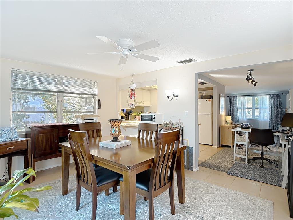 9420 Cochise Lane Port Richey, FL 34668 - Photo 21 of 47 a view of a dining room with furniture