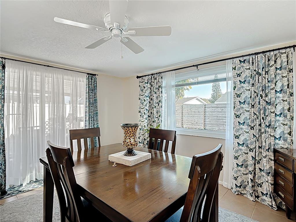 9420 Cochise Lane Port Richey, FL 34668 - Photo 23 of 47 a view of a dining room with furniture window and outside view