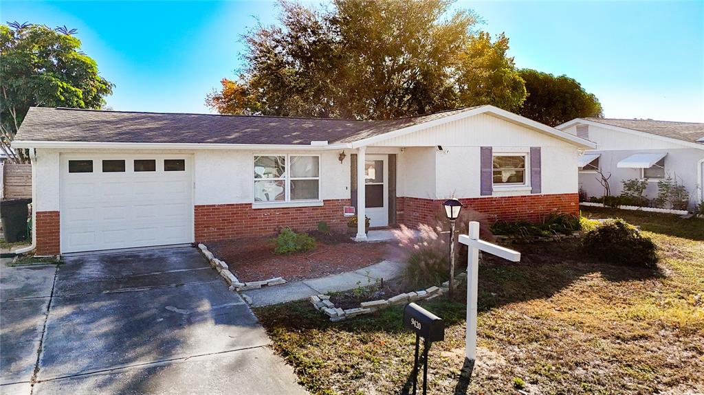 9420 Cochise Lane Port Richey, FL 34668 - Photo 3 of 47 a view of a house with backyard and sitting area