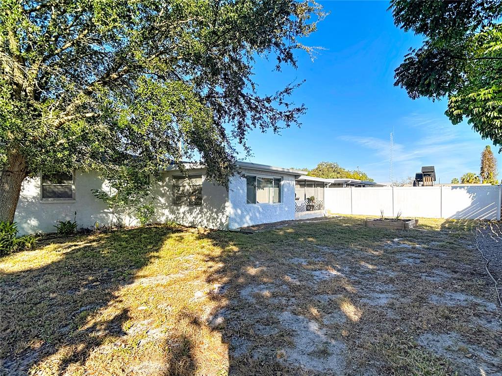 9420 Cochise Lane Port Richey, FL 34668 - Photo 37 of 47 a view of a yard with an trees