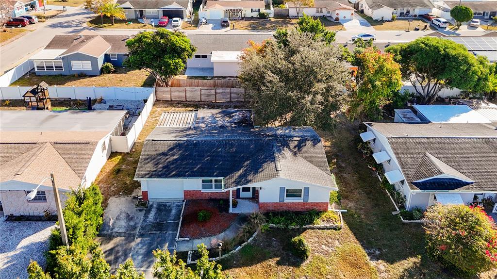 9420 Cochise Lane Port Richey, FL 34668 - Photo 43 of 47 an aerial view of multiple houses with a yard