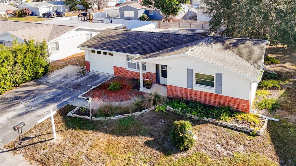 9420 Cochise Lane Port Richey, FL 34668 - Photo 44 of 47 a view of a backyard with plants and a patio