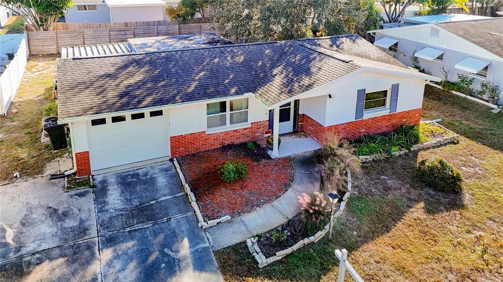 9420 Cochise Lane Port Richey, FL 34668 - Photo 46 of 47 an aerial view of a house with a yard