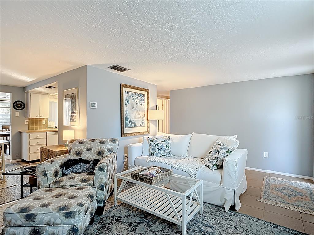 9420 Cochise Lane Port Richey, FL 34668 - Photo 7 of 47 a living room with furniture and a window